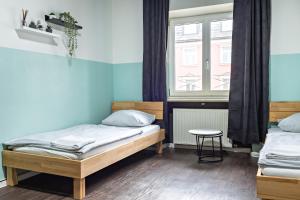 Postel nebo postele na pokoji v ubytování Schwanthaler Hof