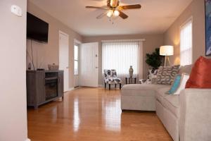 a living room with a couch and a ceiling fan at 318) Extended Stay in Newport News