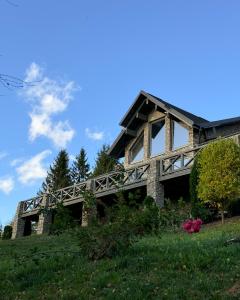 a house on a hill with a bridge at Charlton Estate in Yablunytsya