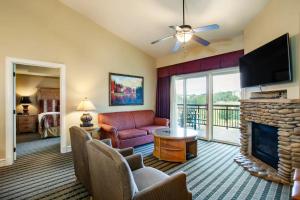 a living room with a couch and a fireplace at Pigeon Forge Adventure #163 in Pigeon Forge