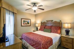 a bedroom with a bed and a ceiling fan at Pigeon Forge Adventure #163 in Pigeon Forge +51 photos