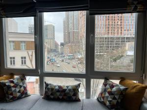 a view of a city from a window at Kiev Centre KPI Apartments in Kyiv +44 photos