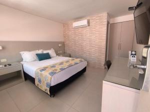 Postel nebo postele na pokoji v ubytování San Martin Cartagena