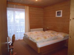 Łóżko lub łóżka w pokoju w obiekcie Pension Herzoggut