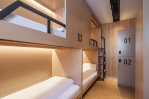 Postel nebo postele na pokoji v ubytování Captain 5 Youth Hotel-Shanghai Laoshan Road Branch