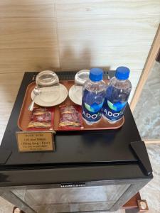 a tray with two bottles of water on a table at Khách Sạn Xuân Huỳnh 3 Sóc Trăng in Soc Trang