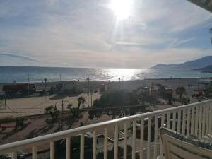 a view of the beach from a balcony at A 10 passi dal mare in Ventimiglia
