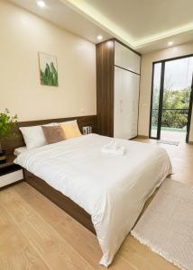 Ένα ή περισσότερα κρεβάτια σε δωμάτιο στο Dfour Home Kim Bôi, Hòa Bình