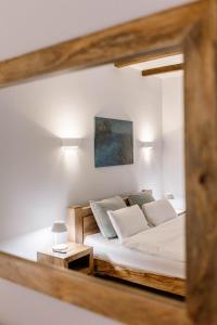 a bedroom with a bed and a mirror at Kosa Śpiew Joga i Spa in Kosewo