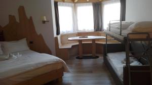 Ένα ή περισσότερα κρεβάτια σε δωμάτιο στο B&B Augusto