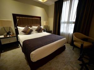 Cama o camas de una habitación en Premium Strato Hotel
