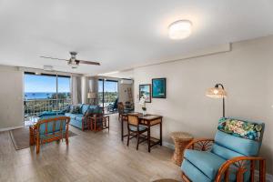 a living room with a couch and chairs and a table at Kailua Village#705 in Kailua-Kona