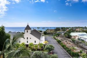 an aerial view of a church with the ocean in the background at Kailua Village#705 in Kailua-Kona