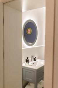a bathroom with a sink and a mirror at Kosa Śpiew Joga i Spa in Kosewo +93 photos