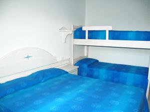 A bed or beds in a room at Baia Fiorita Még 37 kép