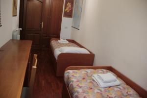 A bed or beds in a room at Dimora Re di Roma - Rome Apartment