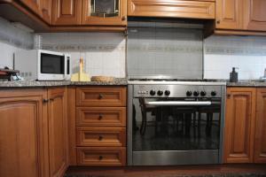 A kitchen or kitchenette at Dimora Re di Roma - Rome Apartment