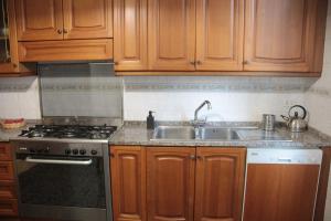 A kitchen or kitchenette at Dimora Re di Roma - Rome Apartment
