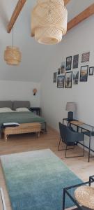 a living room with a bed and a table at Łagowski Reset in Łagów