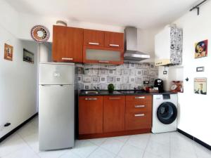 Kuchyň nebo kuchyňský kout v ubytování La Casa del Pesto - Guest House