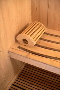 a roll of toilet paper sitting on a shelf in a sauna at Rooms Don Alfonso in Parma +57 photos