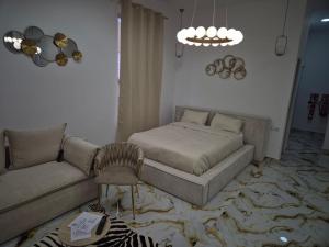Posteľ alebo postele v izbe v ubytovaní Downtown Apartments
