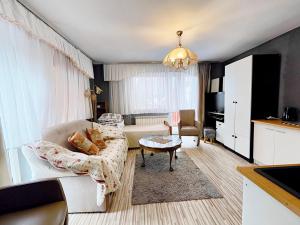 a living room with a couch and a table at U Dany in Białka Tatrzanska