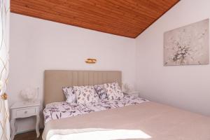 Posteľ alebo postele v izbe v ubytovaní Apartment IliSa