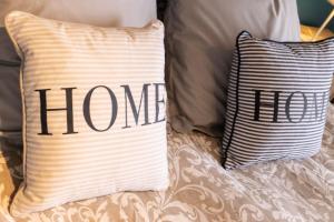 En eller flere senge i et værelse på Le cottage roannais