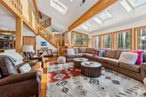 a living room with a couch and a table at Apres Ski Haven Pet Friendly with Private Hot tub in Breckenridge
