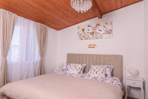 Posteľ alebo postele v izbe v ubytovaní Apartment IliSa