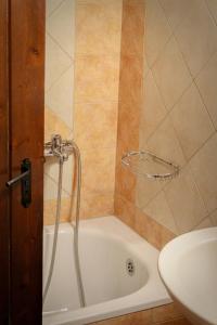 a shower in a bathroom with a tub and a sink at Το Πατρικό in Kato Loutraki +19 photos