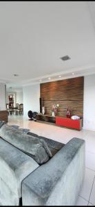a living room with a couch in the middle at Casa de alto padrão para COP30 in Belém +6 photos