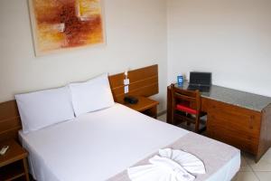 Postel nebo postele na pokoji v ubytování Hotel Dan Inn Barretos by Nacional Inn