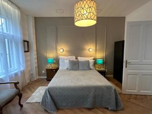 Posteľ alebo postele v izbe v ubytovaní Pelso Luxury Apartments