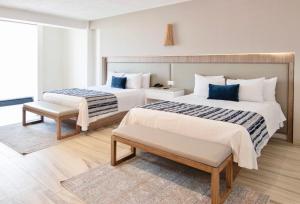 Una cama o camas en una habitación de Hotel Velvet Plaza