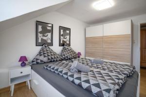 a bedroom with a large bed in a room at Haus Biene am Meer in Norden