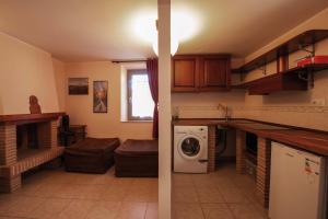 Kuchyň nebo kuchyňský kout v ubytování Apartment Nonna Delia