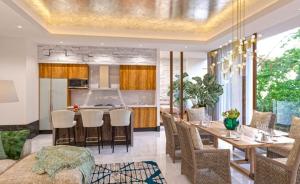 a dining room and kitchen with a table and chairs at Vidanta Nuevo Vallarta in Nuevo Vallarta 