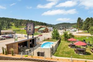 an aerial view of a resort with a pool at Lantern Inn in Hill City