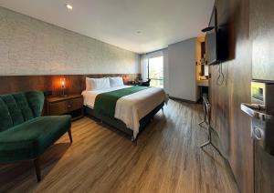 Voodi või voodid majutusasutuse Cafe Hotel Medellín toas