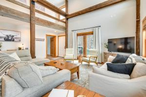 a living room with two couches and a tv at Fish, Hike and Ski Spacious Family Escape in Eden in Eden