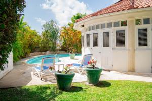a villa with a pool and a house at ZenBreak Marzalea Villa 3bd in Saint James