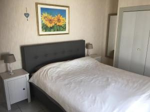 Ένα ή περισσότερα κρεβάτια σε δωμάτιο στο Beach house Océan Ile de Ré
