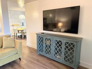 a living room with a television on a wall at 2109 Landfall Way in Seabrook Island