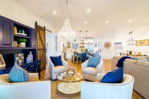 a living room with a couch and chairs and a table at Summer STATus in Mooresville