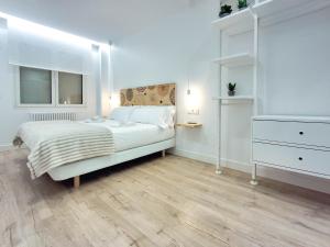 A bed or beds in a room at AKURA apartment, con aire acondicionado
