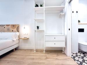 A bed or beds in a room at AKURA apartment, con aire acondicionado