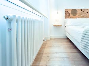 A bed or beds in a room at AKURA apartment, con aire acondicionado