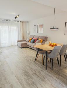 a living room with a couch and a table at The Garden House in Alicante